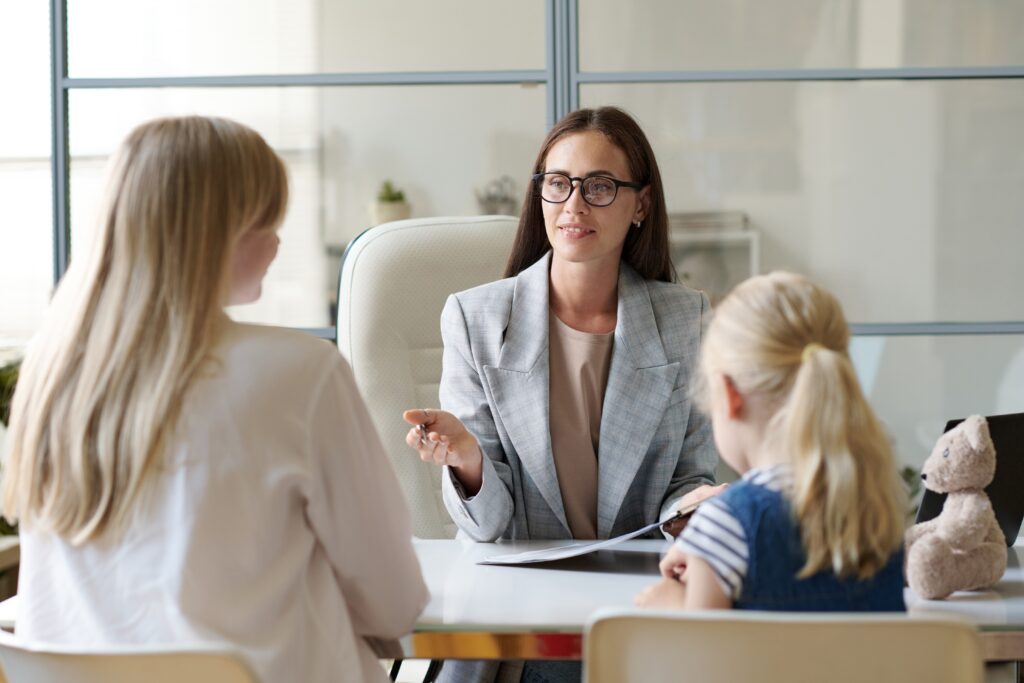 professionals talking to parents and child for adhd