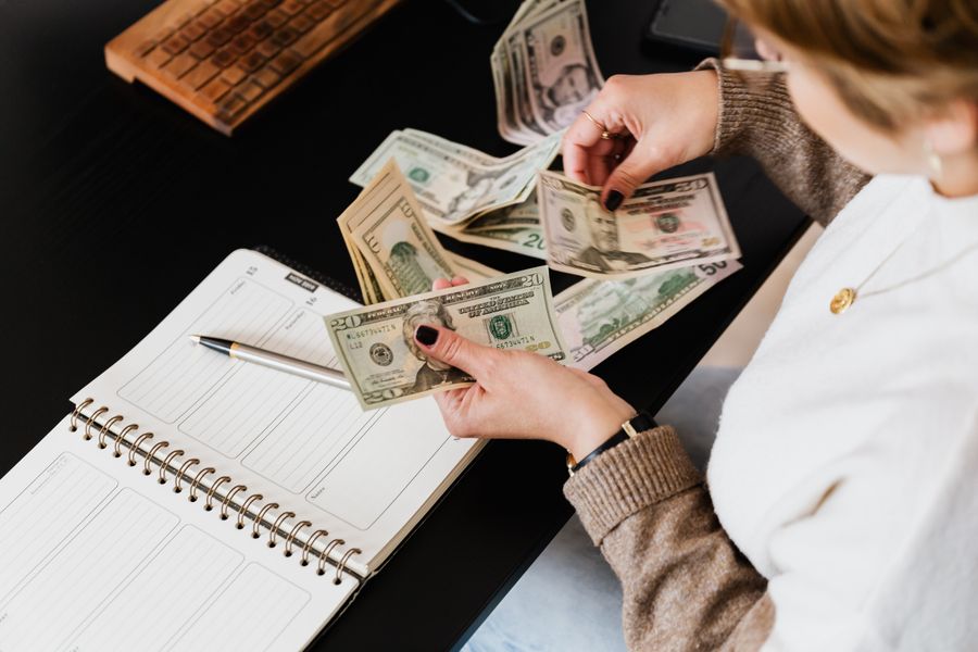 Parent reviewing the cost of educational consulting and testing services at a desk