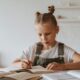 Child concentrating on schoolwork during a psychoeducational evaluation in Denver