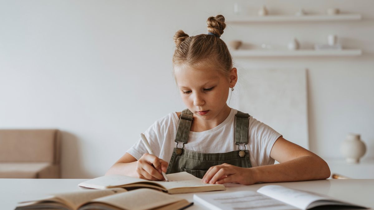 Child concentrating on schoolwork during a psychoeducational evaluation in Denver